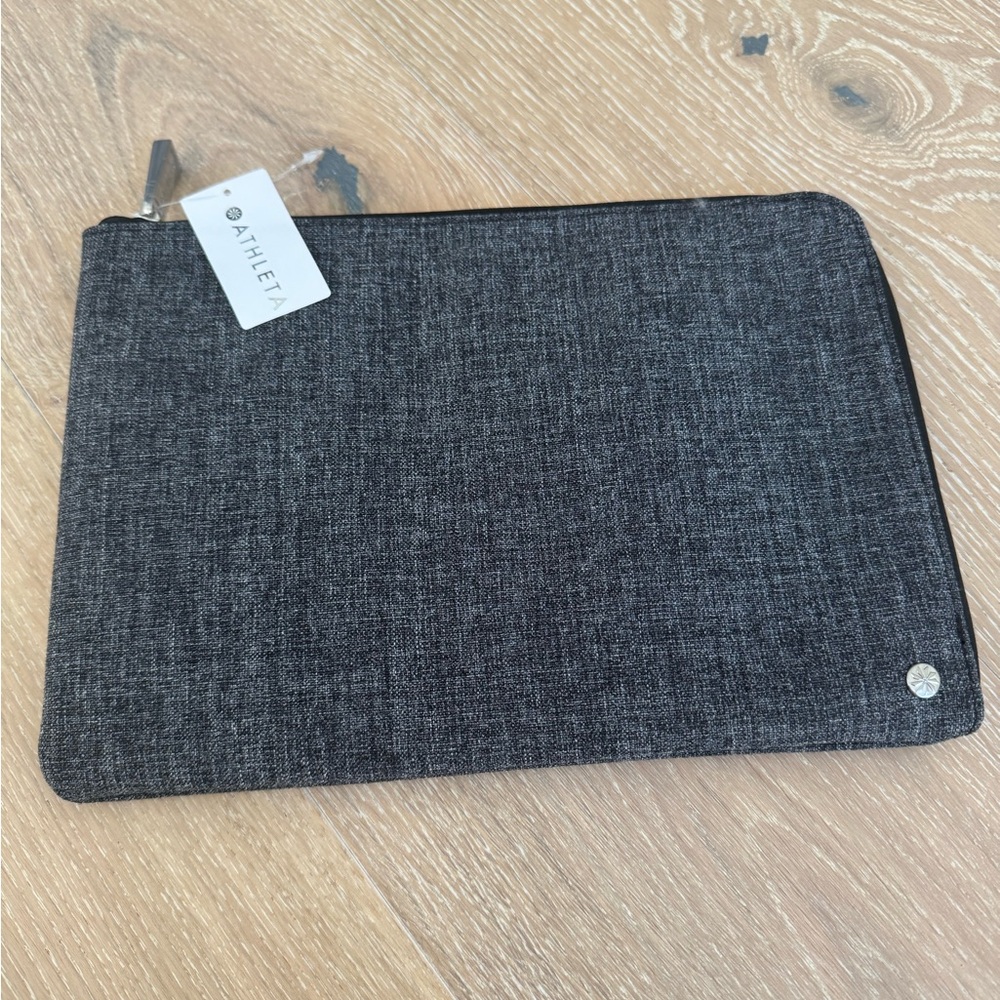 ATHLETA. Urban tech pouch. Charcoal grey. Size: 11 in x 7.5 in. Inside pockets.